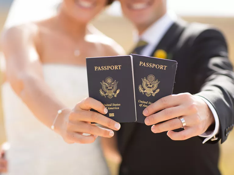 can i travel on maiden name passport