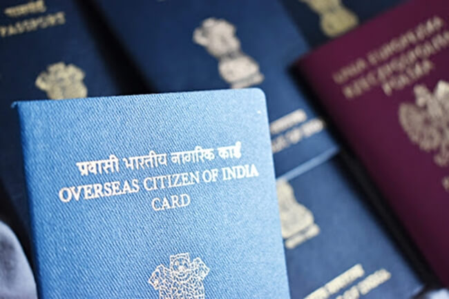 can i travel with old oci and new passport 2022