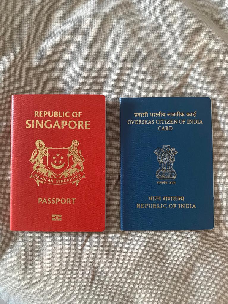 can i travel with old oci and new passport 2023