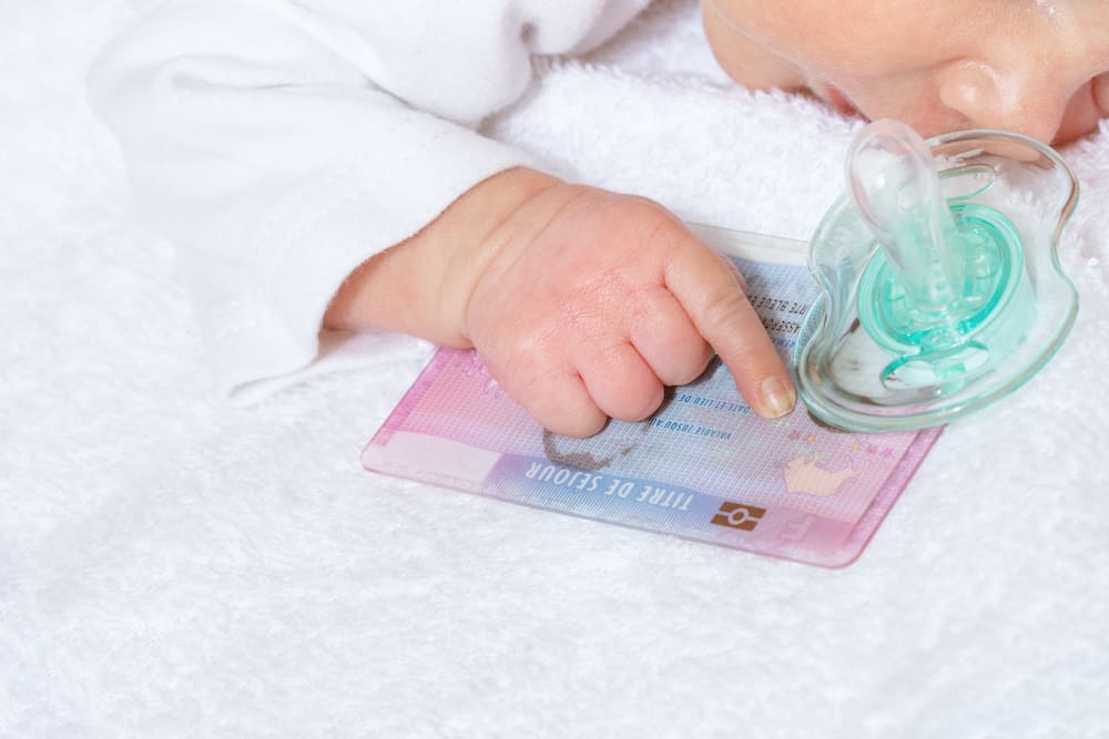 does newborn need passport to travel